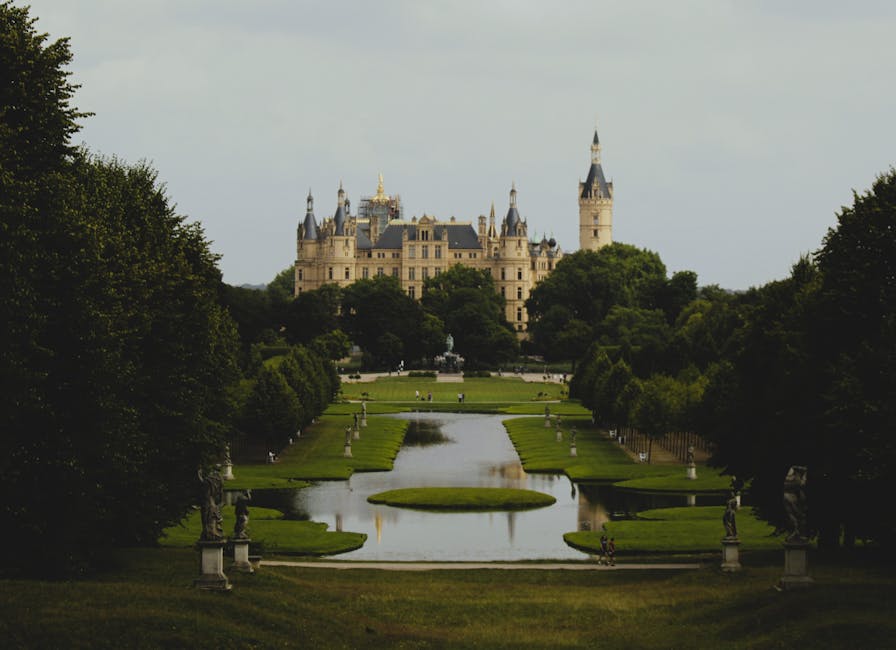 Explore the grand architecture and lush gardens of Schwerin Castle, a historical landmark in Germany.